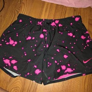 Dark gray Dri-Fit Nike shorts with pink design